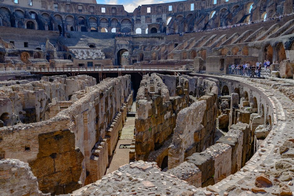 View of the iconic Colosseum interior in Rome, showcasing ancient architecture and ruins.