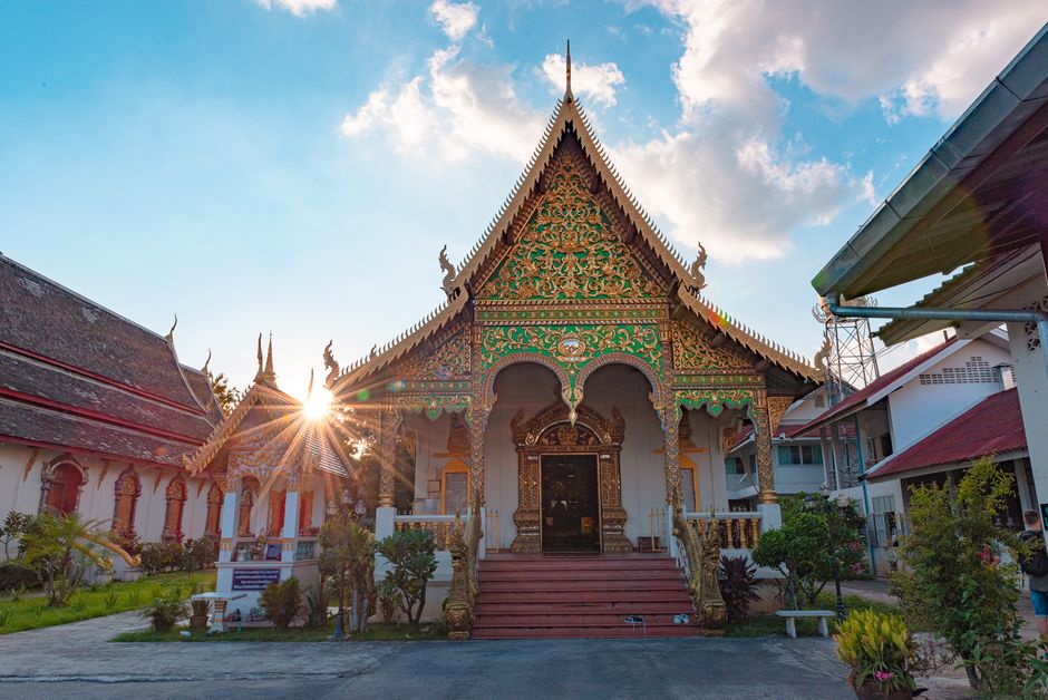 Beautiful ornate temple facade with sunburst at Wat Chiang Man, showcasing traditional Thai architecture