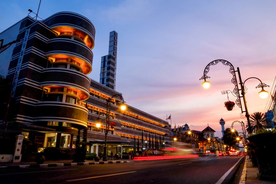 A stunning view of Art Deco architecture in Bandung, Indonesia during a vibrant sunset.