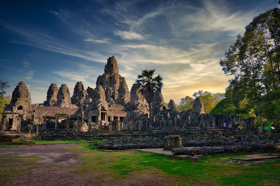 Discover the ancient Bayon Temple in Cambodia, captured at sunset with dramatic skies.