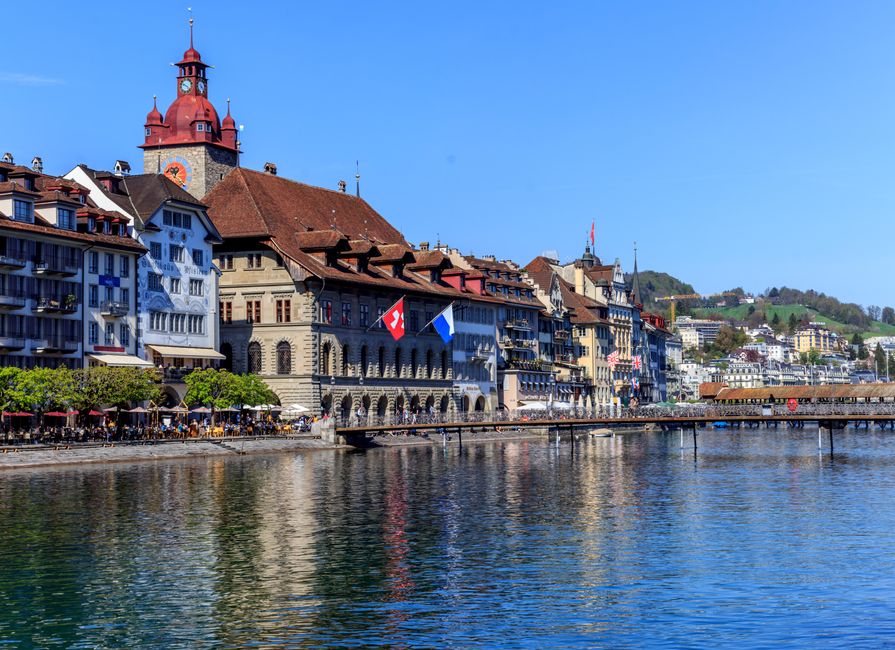Charming cityscape of Lucerne, Switzerland, showcasing historic buildings and waterfront reflections
