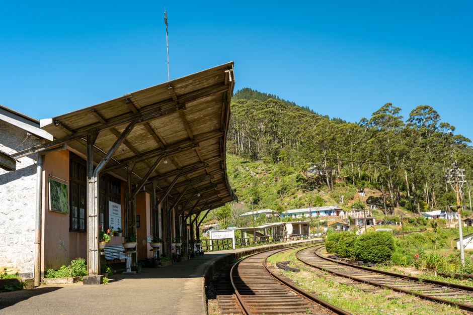 Charming railway station amidst lush greenery in Sri Lanka, capturing the essence of serene travel and nature