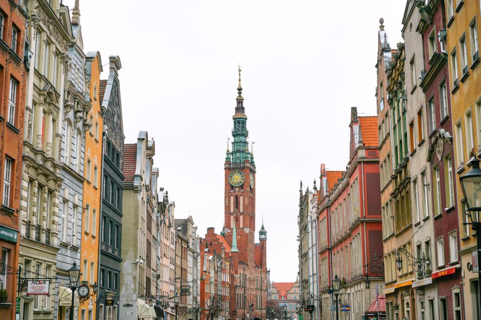Charming view of historic architecture in Gdańsk's Old Town with iconic tower