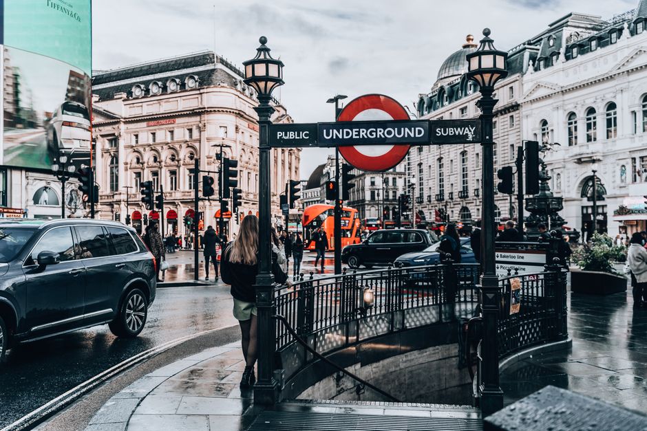 A vibrant scene at Piccadilly Circus, London, featuring iconic landmarks and city life.