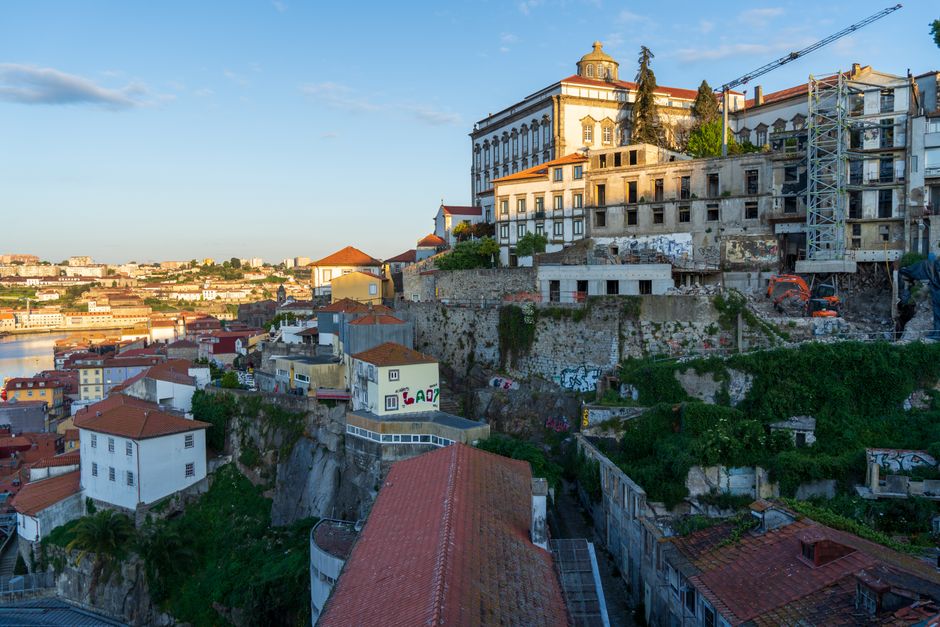 A stunning view of Porto's historic buildings at sunset, showcasing the city's unique architecture.