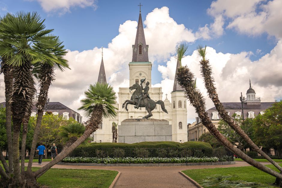 Elegant view of Jackson Square with St. Louis Cathedral and equestrian statue under a bright sky in New Orlean