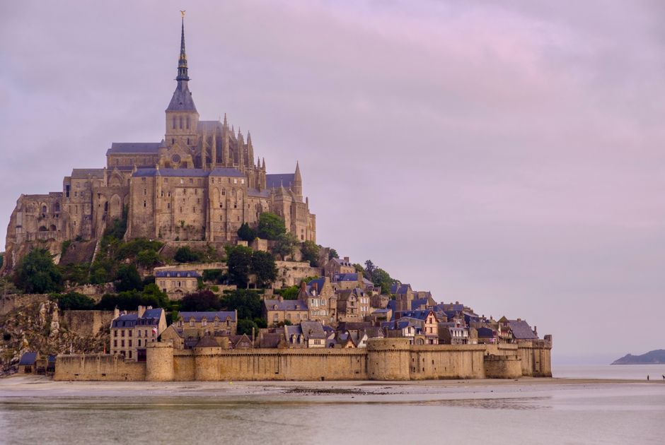 Explore the stunning architecture of Mont Saint-Michel in Normandy, France, captured in a serene setting