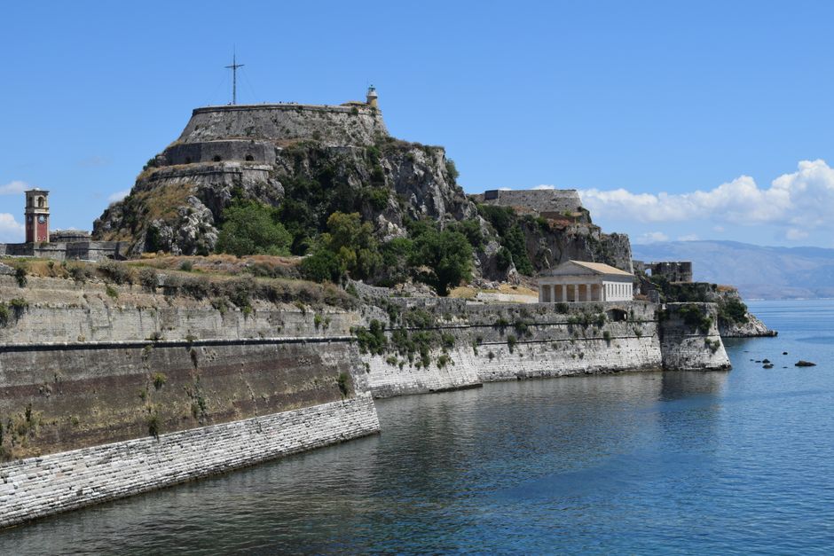 Historic Old Fortress of Corfu overlooking the Ionian Sea under a clear blue sky