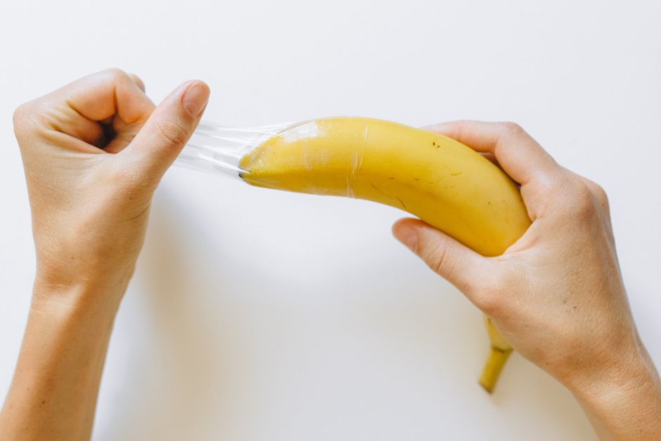 A conceptual image showing a banana with a condom to illustrate safe sex practices.
