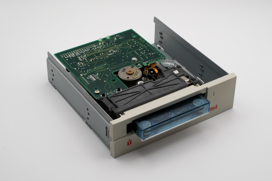 Close-up of a vintage internal Zip disk drive showcasing electronic components.