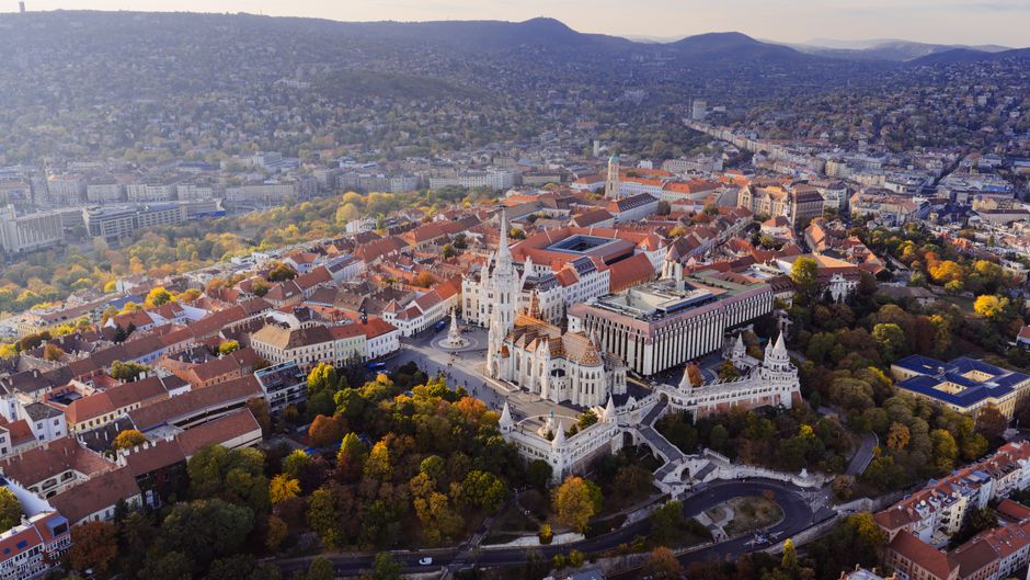 Stunning aerial view of Fisherman's Bastion and Matyas Church in Budapest's Buda Castle District.
