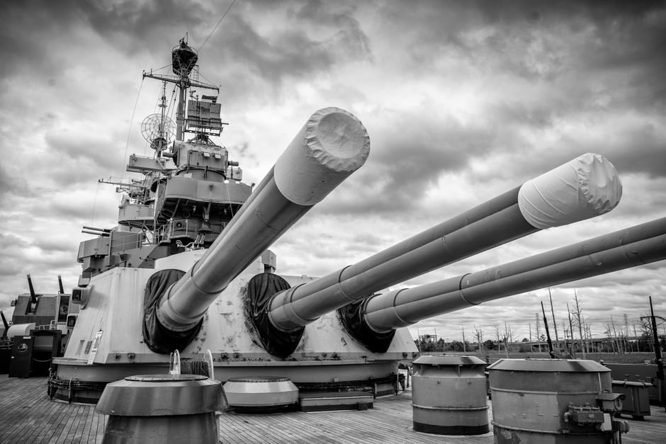 Dramatic low angle shot of a battleship in Wilmington, NC in black and white.