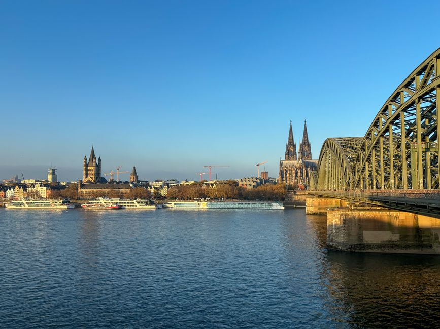 Scenic view of Cologne's iconic cathedral and Hohenzollern Bridge over the Rhine River