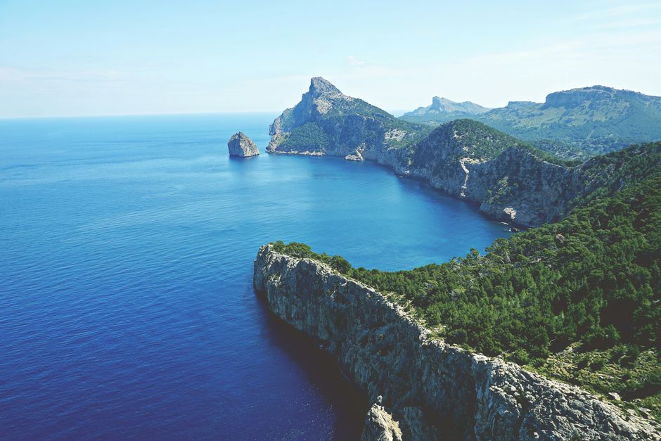 Stunning aerial view of Cap de Formentor in Mallorca with clear blue waters and rugged cliffs