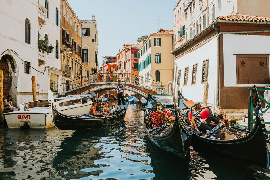 Experience the allure of Venice canals with gondolas, historic buildings, and iconic footbridges.