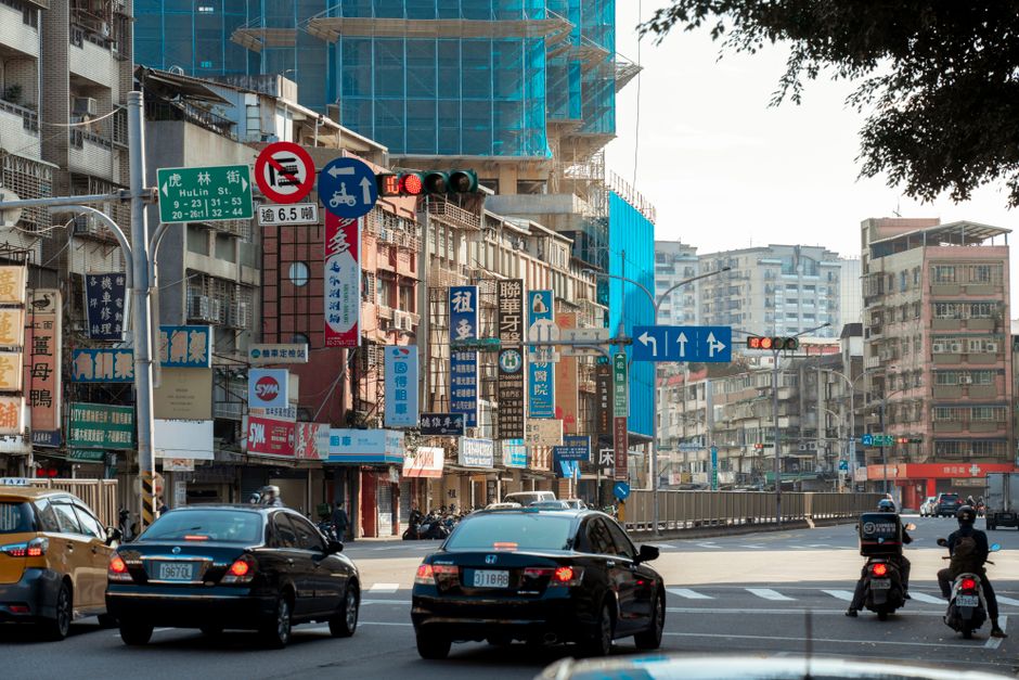 Urban scene of traffic and architecture in Taipei, Taiwan. Daytime cityscape.